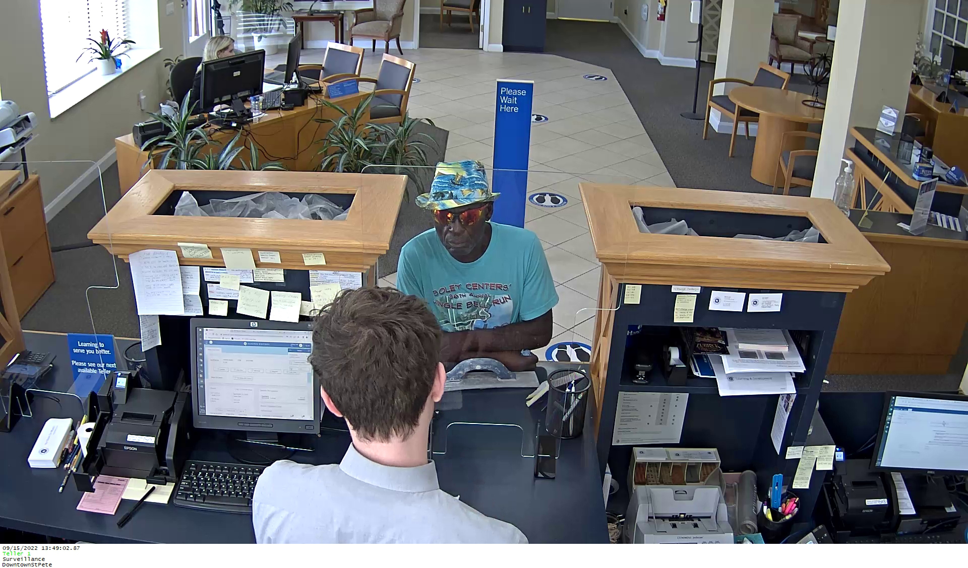 Robbery Suspect standing at counter