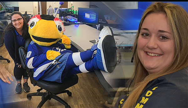 employees sitting with Bolts mascot Thunder Bug